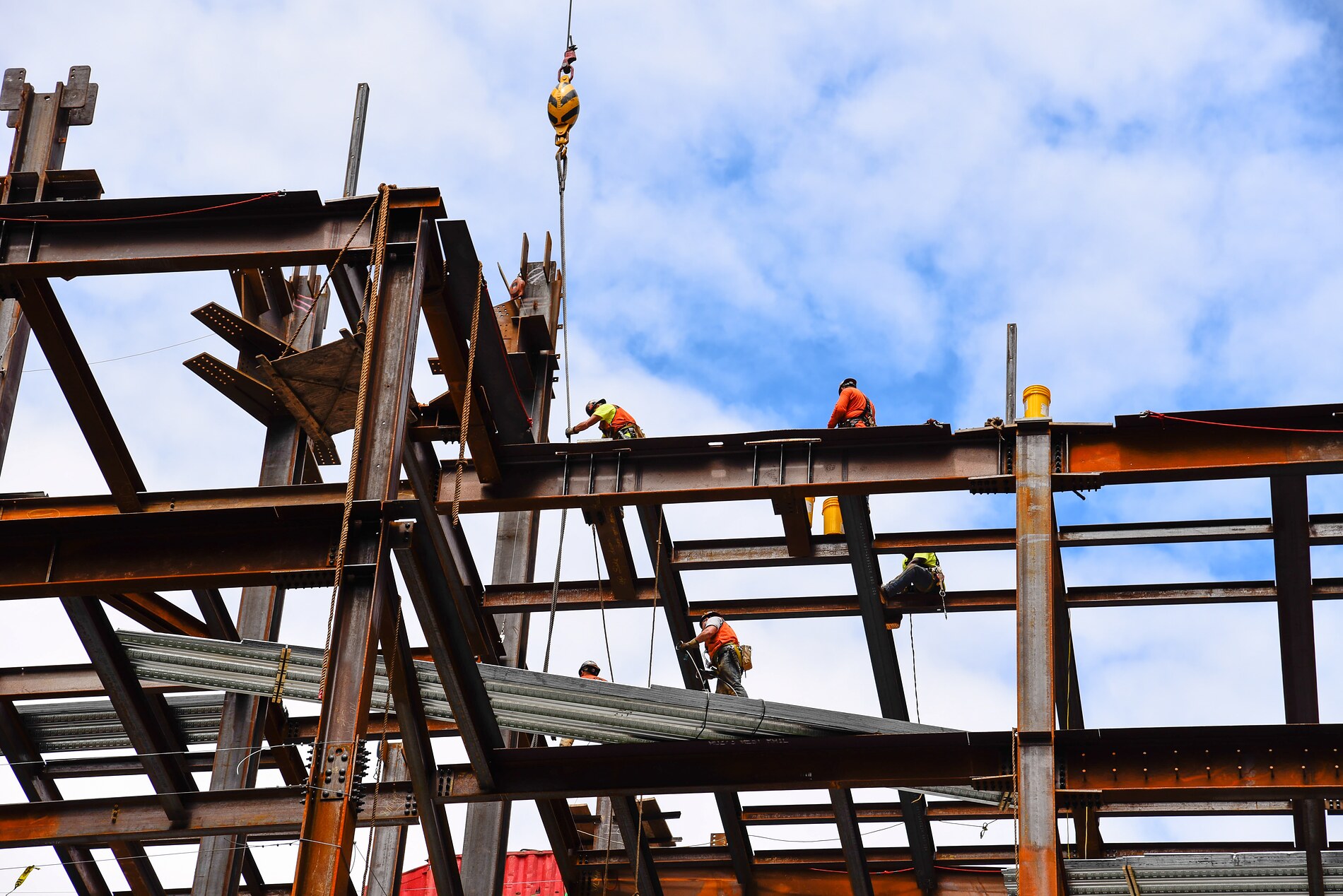 MBA members building the steel frame of a high-rise